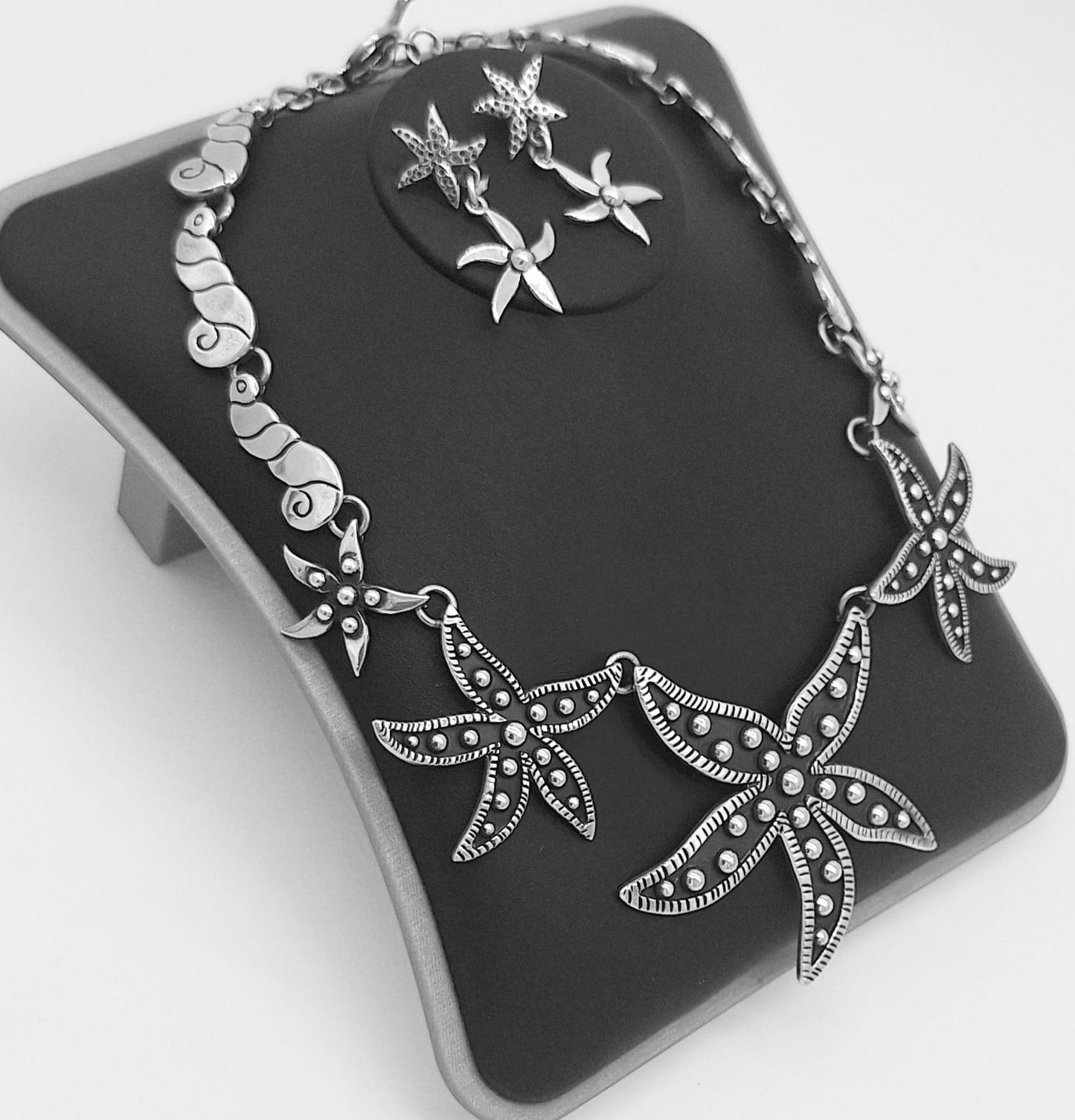 SET DE COLLAR Y ARETE, ESTRELLA DE MAR DE PLATA LEY 925.