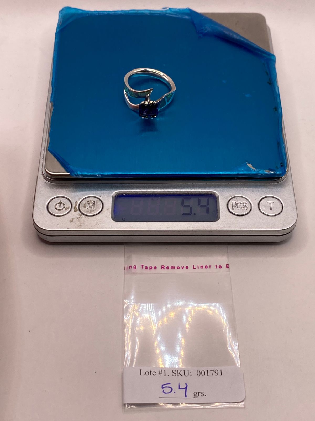 Anillo de Ópalo de Fuego y Zirconia Azul en Plata Ley .950