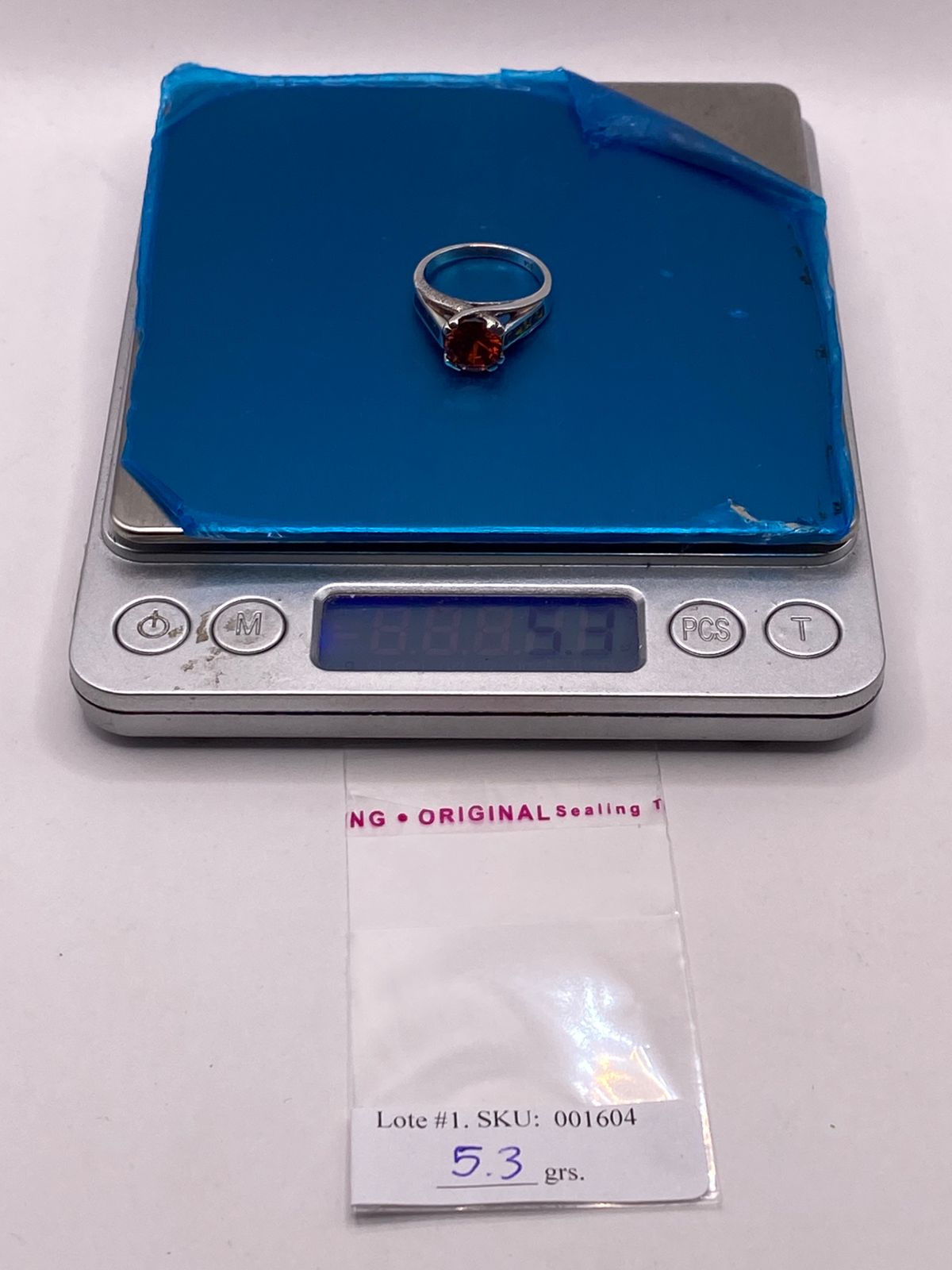 Anillo Solitario de Plata Ley 950 con Ópalo de Fuego y Zirconia