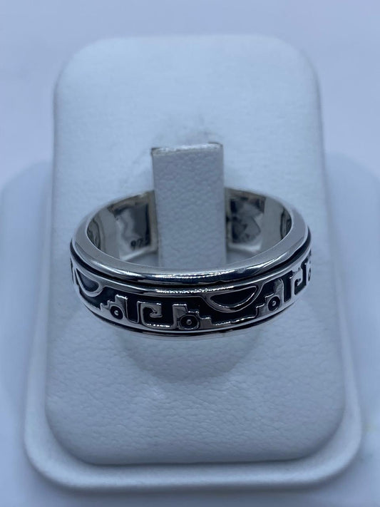 Banda spinner plata 925 con friso de glifos mesoamericanos en relieve oxidado negro y rieles pulidos, Arte Taxco