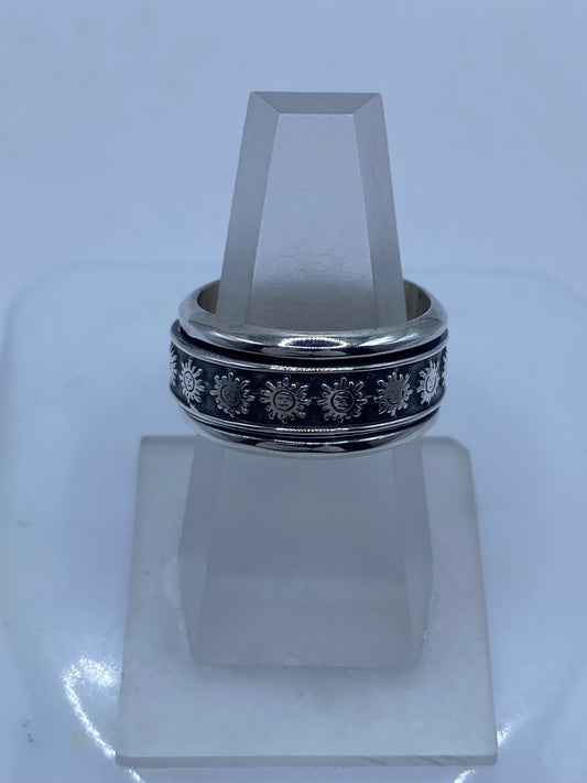 Banda spinner plata 925 con soles de rostro humano en relieve sobre fondo oxidado negro, Arte Taxco