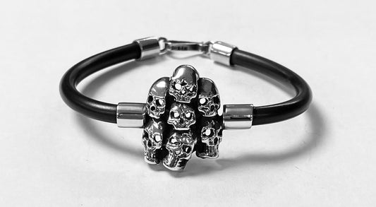 BRAZALETE DE SIETE CRANEOS  EN PLATA LEY 925  CON CAUCHO