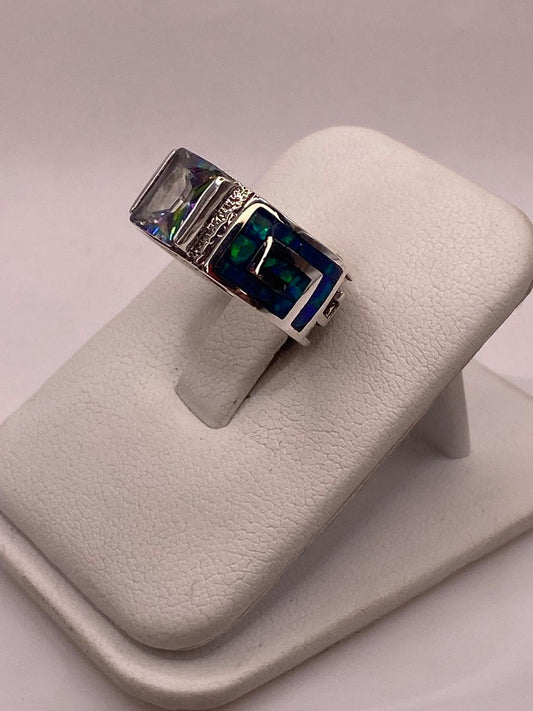 ANILLO GRECA EN PLATA LEY .950 CON ÓPALO DE FUEGO Y ZIRCONIA, vista frontal