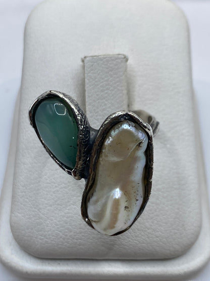 Anillo ajustable de plata con turquesa azul cielo en marco arquitectónico prehispánico
