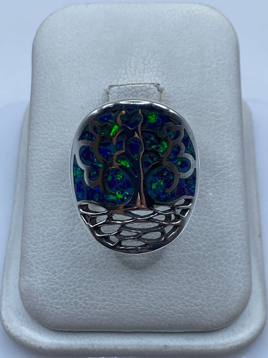 Anillo de plata .950 con Ópalo de Fuego morada engastado, vista frontal en estuche blanco