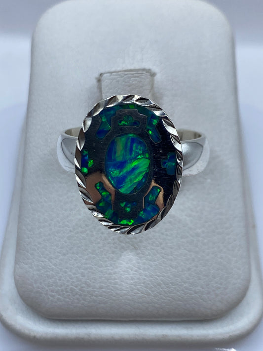 Anillo de plata .950 con ópalo de fuego azul en estuche blanco, vista frontal