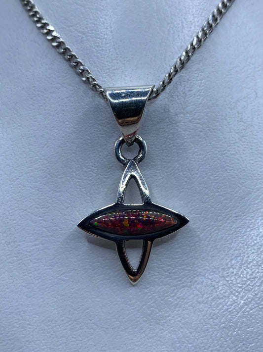 Dije de plata .950 con ópalo de fuego rojo-naranja en forma geométrica de Taxco