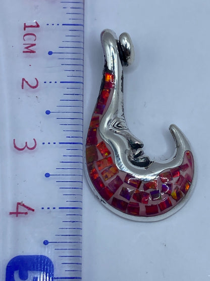 Reverso del dije con granulado decorativo y marca de Quinto .950