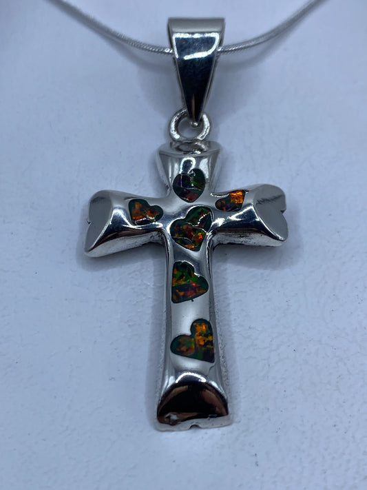 Cruz dije de plata .950 con ópalo multicolor engastado a mano