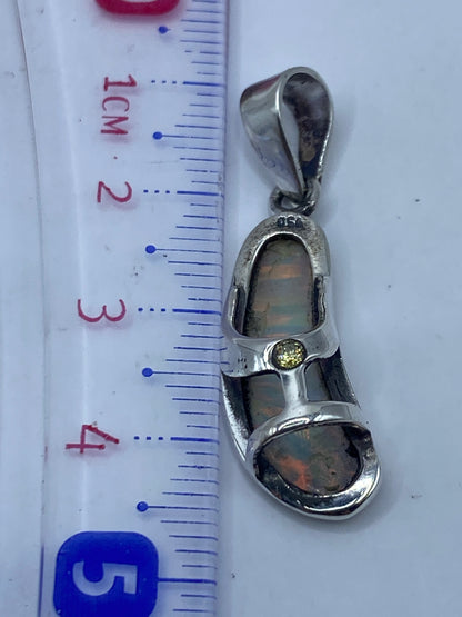 Reverso del dije mostrando el Quinto .950 grabado y el engaste preciso de la piedra