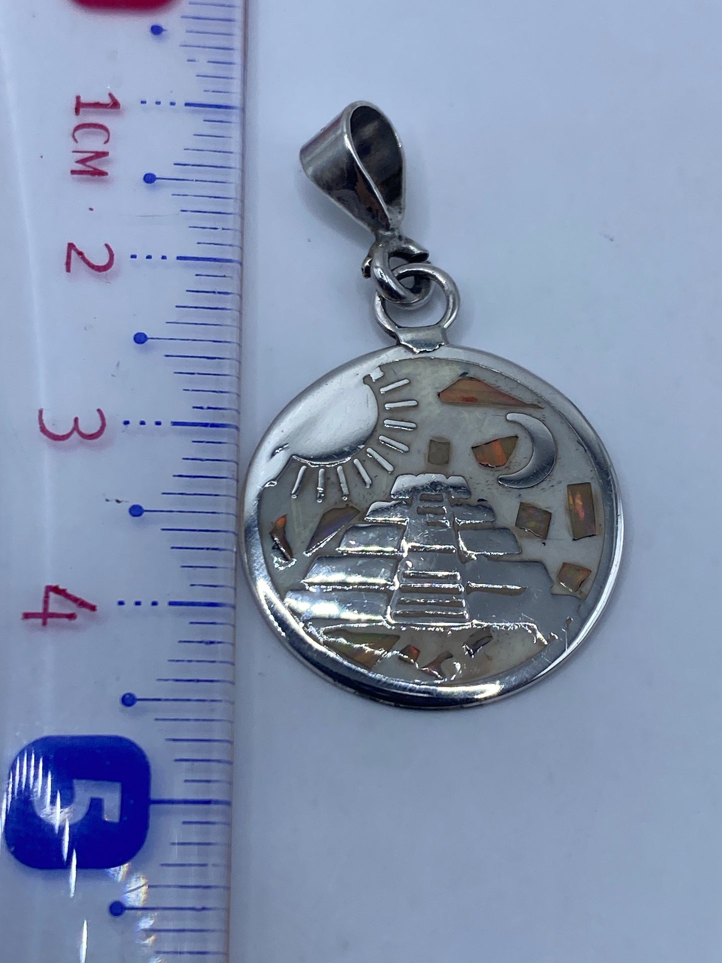 Reverso del dije mostrando el Quinto .925 y la plata pura