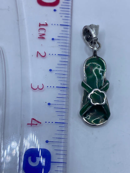 Dije de plata .925 mostrando el Quinto de autenticidad grabado