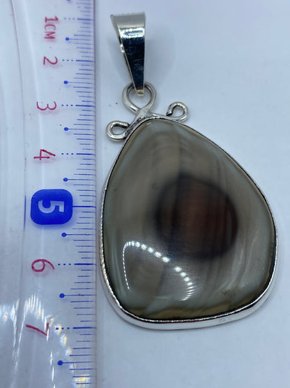 Certificado de autenticidad y peso 10.6 g del dije de plata .950