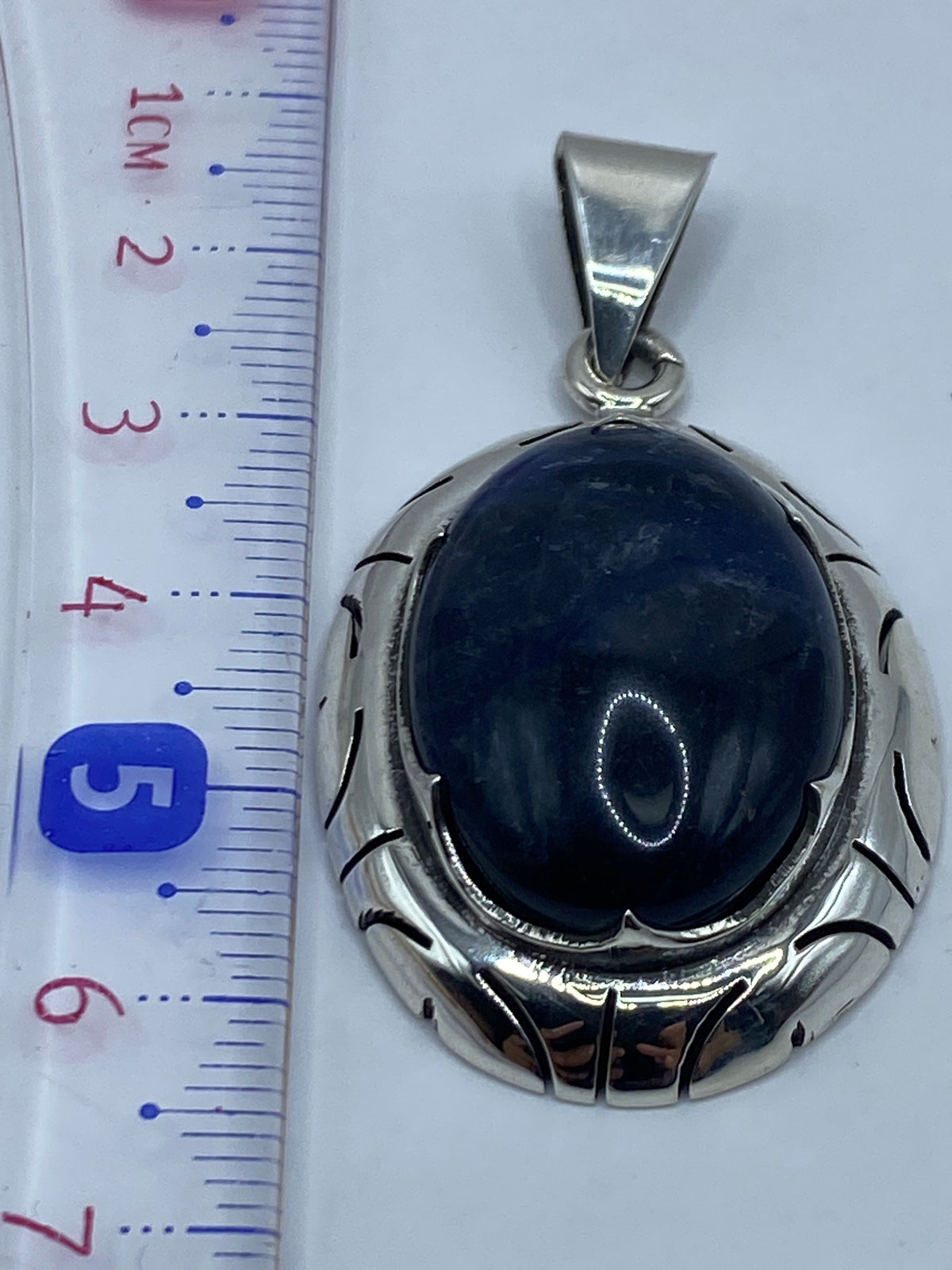 Plata .950 con Quinto visible en el reverso del dije