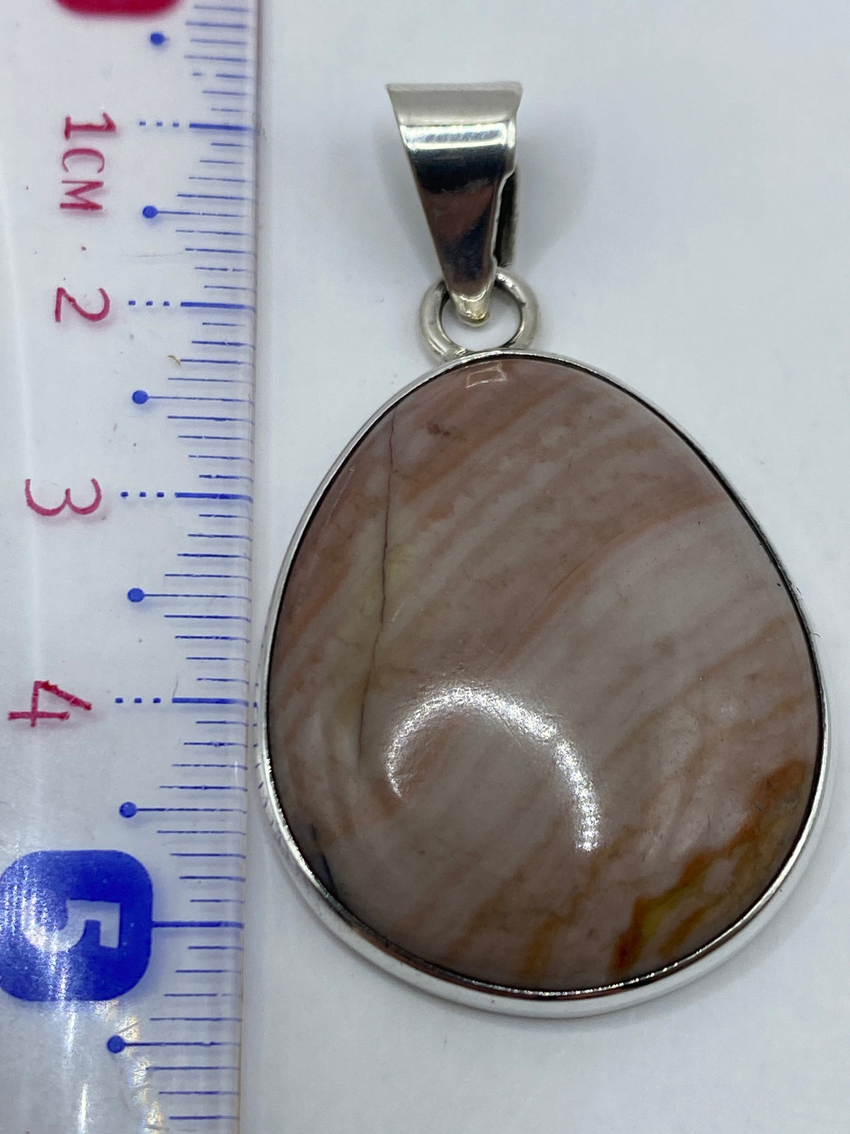 Reverso del dije con el Quinto .950 grabado — certificado de autenticidad