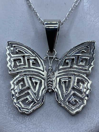 Dije mariposa calado en plata .925 de Taxco con motivos geométricos, 4.3 cm