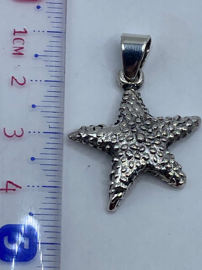 Dije en balanza de precisión pesando 5.5 gramos, plata auténtica