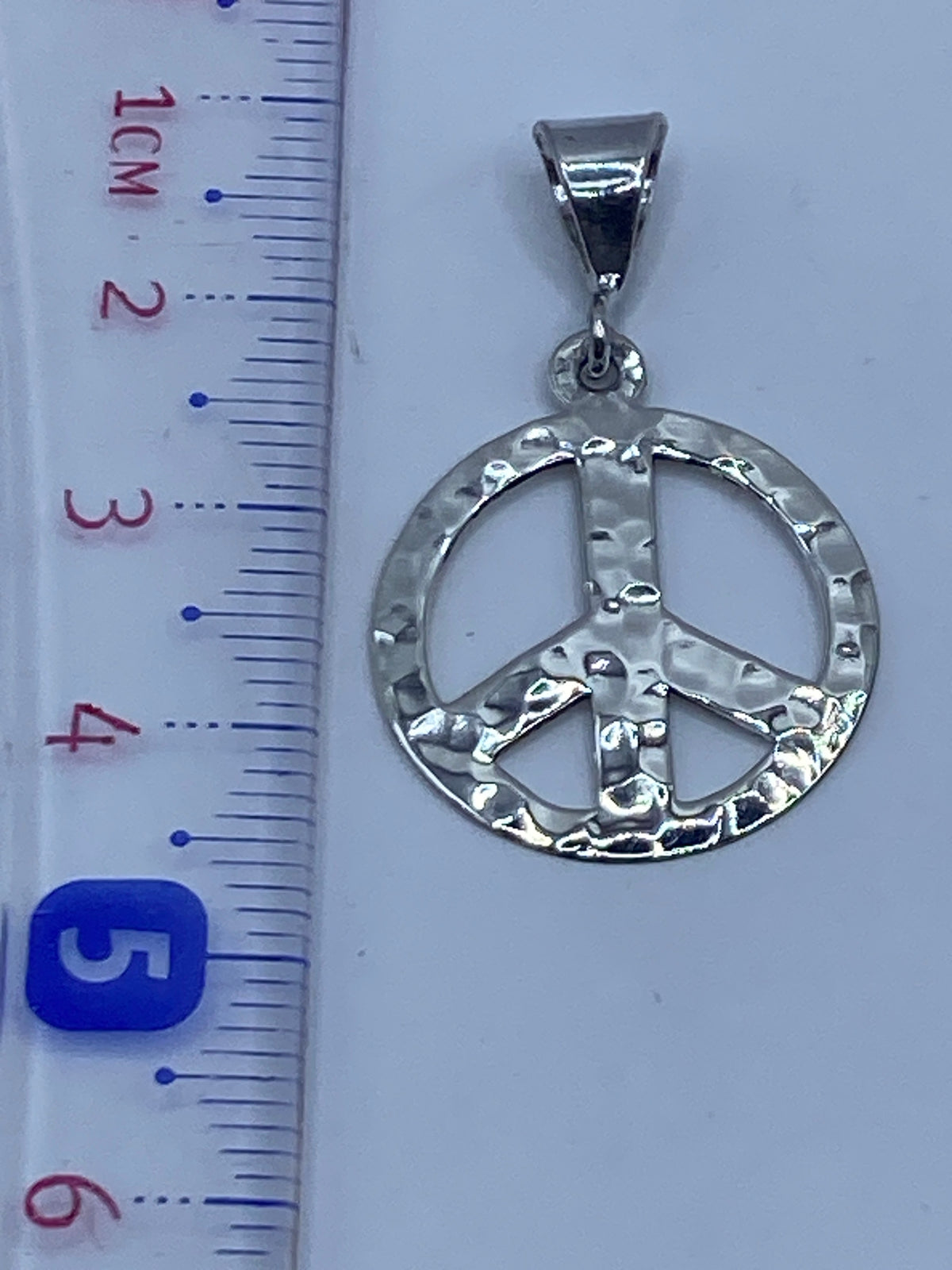 Símbolo de paz en plata .925 de Taxco — pieza delicada y versátil