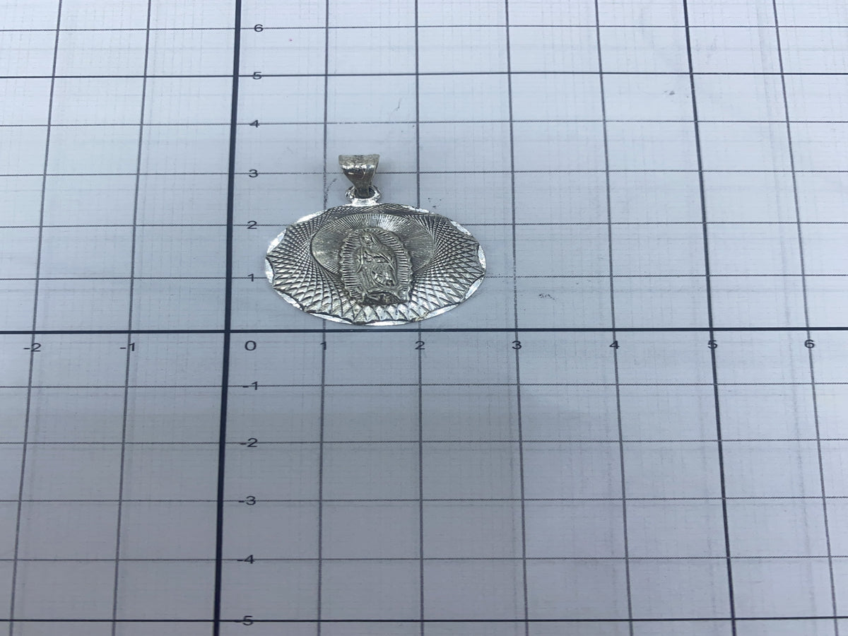 Dije pesado en báscula de precisión: 3.6 gramos de plata pura