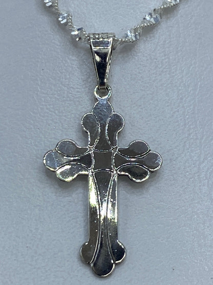 Dije de cruz en plata .925 de Taxco, 3 cm de largo, con brazos decorativos