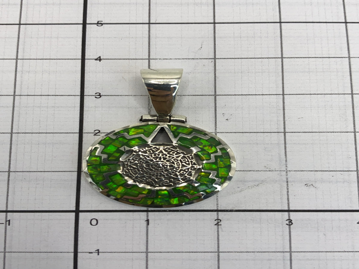 Reverso del dije mostrando el Quinto .950 grabado en la plata