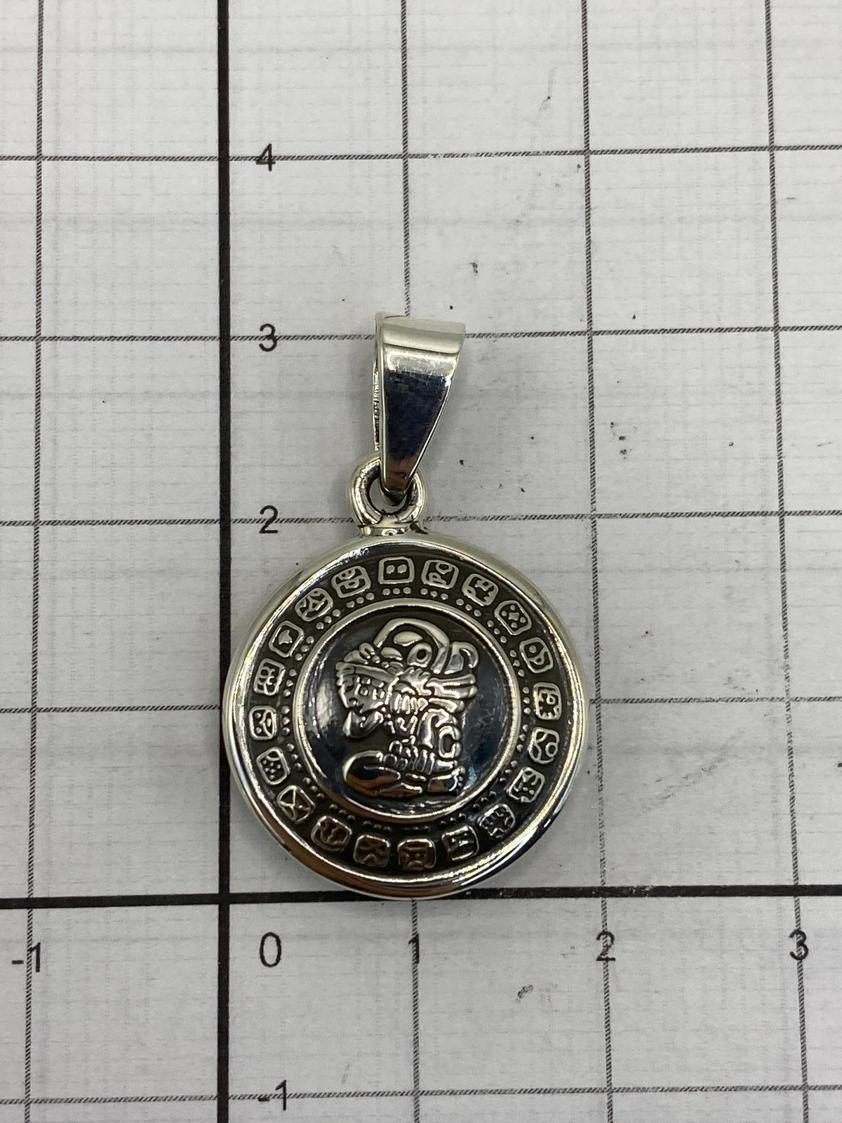 Plata 925 pura — Quinto grabado en el reverso del dije de Taxco