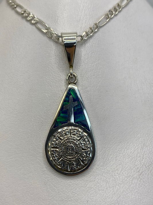 Dije de plata 950 con cruz y Calendario Azteca en ópalo de fuego azul