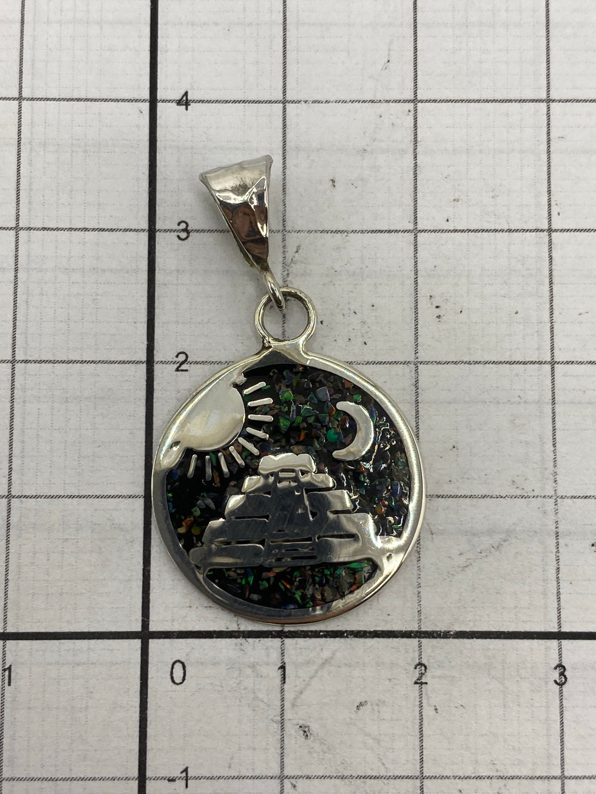 Reverso del dije de plata 925 mostrando el Quinto 925 y la marca MEXICO