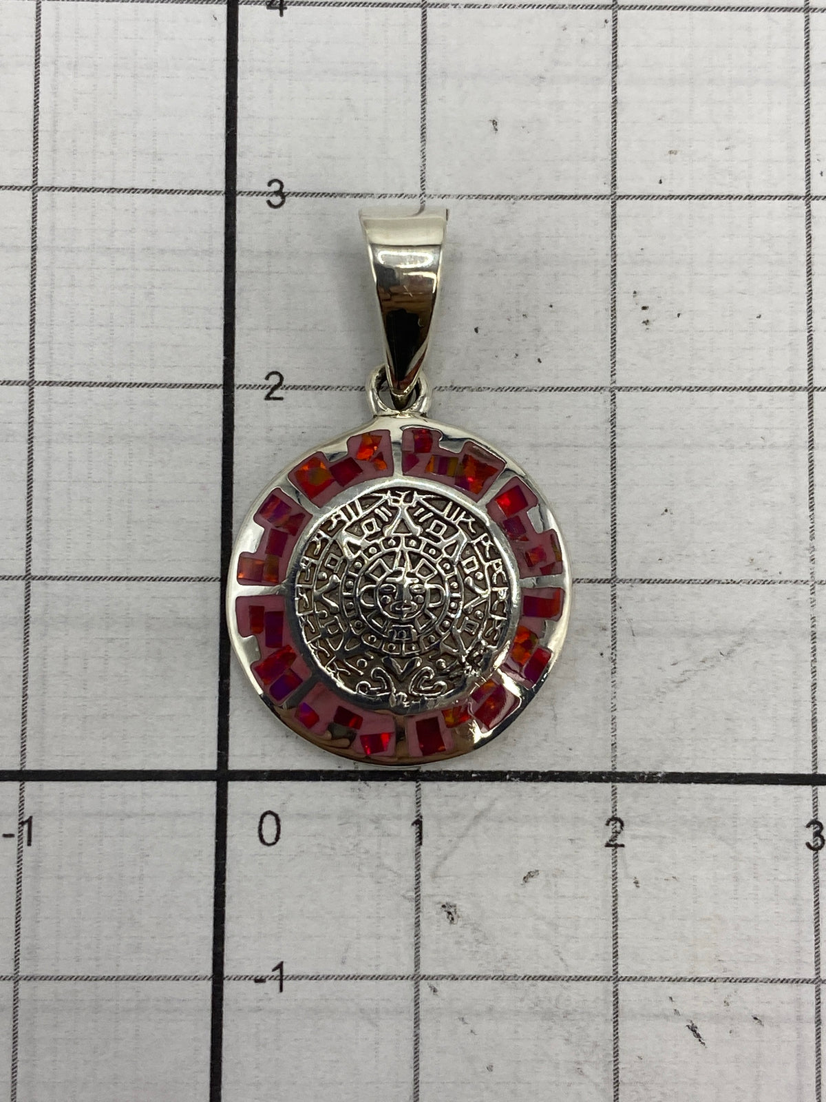 Reverso del dije mostrando el Quinto 950 grabado en plata pura