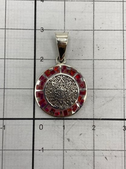 Reverso del dije mostrando el Quinto 950 grabado en plata pura