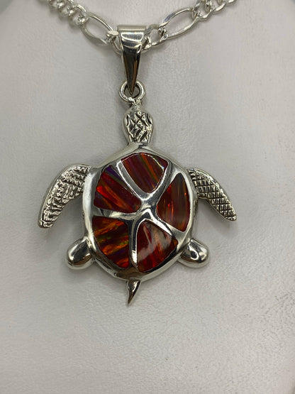 Dije de tortuga marina en plata 950 con ópalo de fuego multicolor, sobre cadena de plata