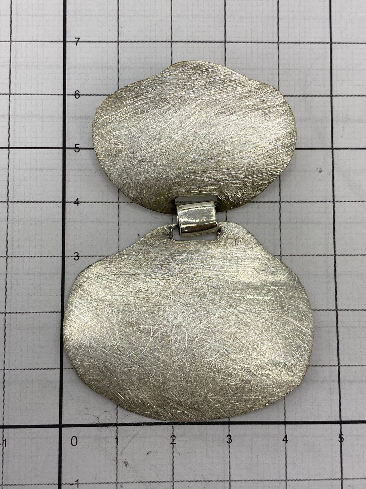 Reverso del dije de plata con marca de Quinto 925