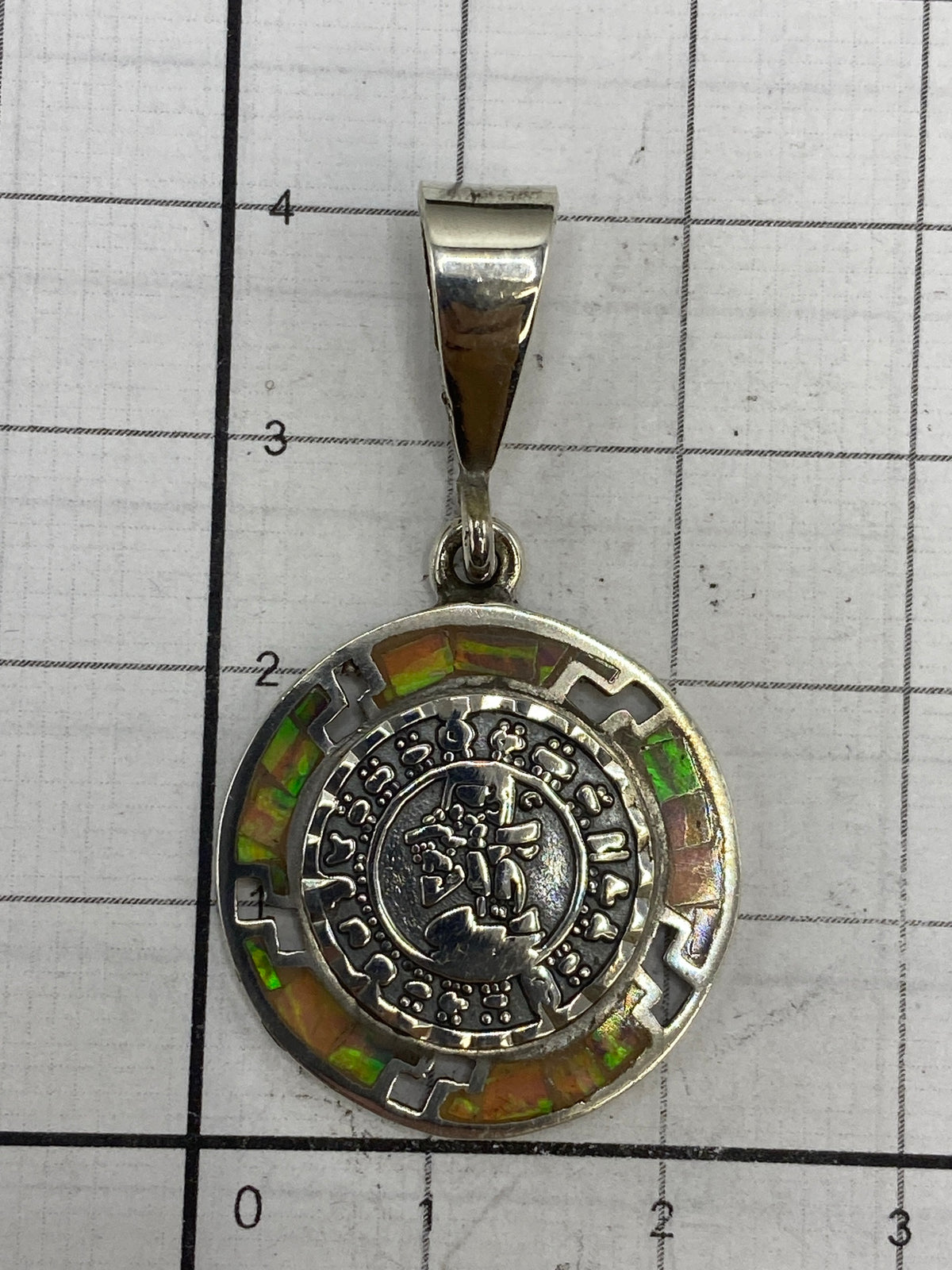 Reverso del dije mostrando el Quinto 950 y la marca de Taxco