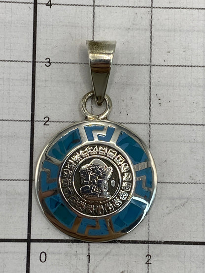 Reverso del dije con sello de Quinto 950 y marca de Taxco