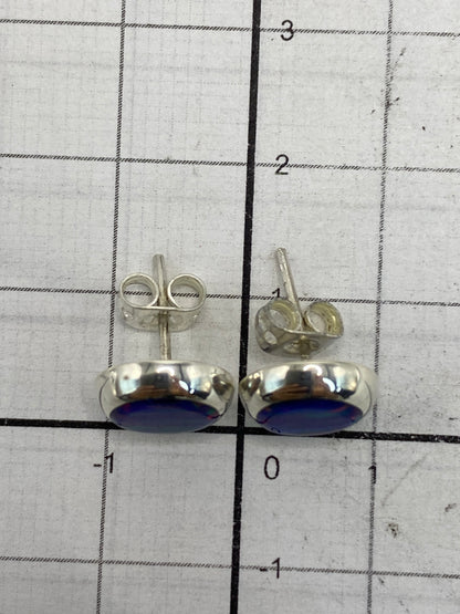 Reverso de los aretes con el Quinto 925 y broches de presión
