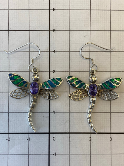 Pair of silver dragonfly earrings with Fire Opal on white background, showing Quinto hallmark