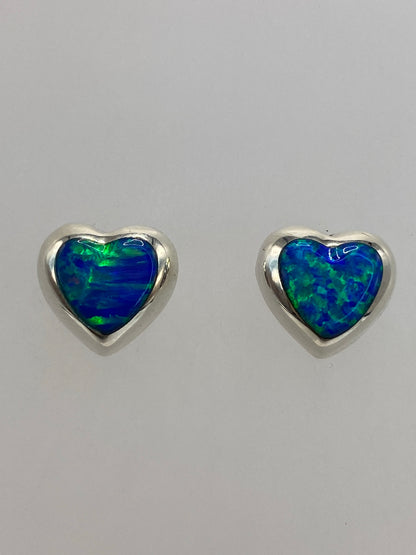 Aretes de plata con ópalo azul vistos desde atrás, presilla de presión de plata