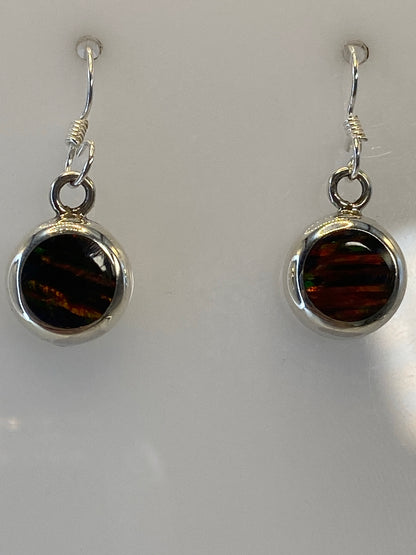 Silver earring with fire opal measuring 2.5 cm, displayed on metric ruler