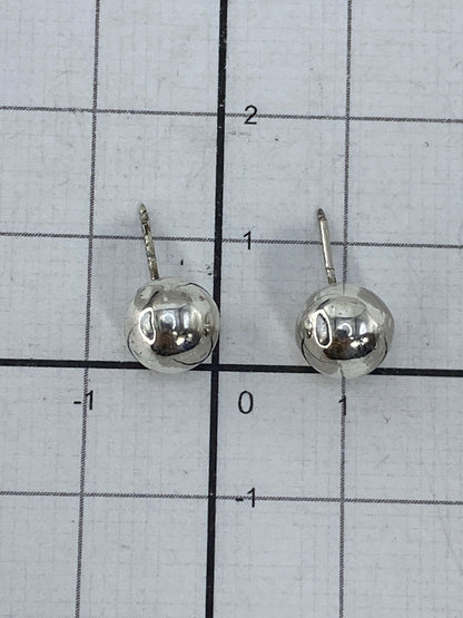 Aretes de cartoneado Taxco junto a regla de medida de 1 cm