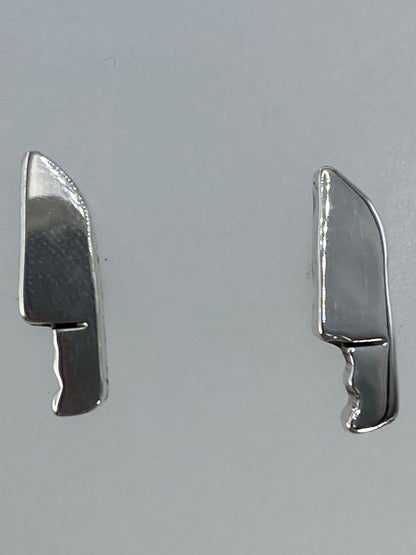 Aretes sobre medida comparativa mostrando el pequeño tamaño de 1.1 cm