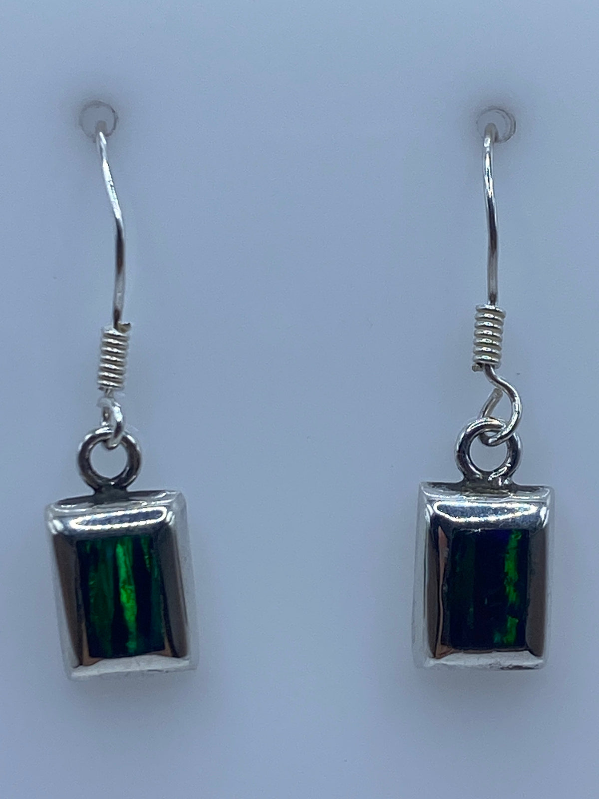 Pair of square silver earrings with fire opal stone, 2.9 cm long, on white background
