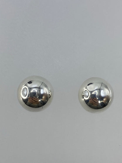 Arete individual de plata pulida 1.5 cm, detalle de la técnica de cartoneado