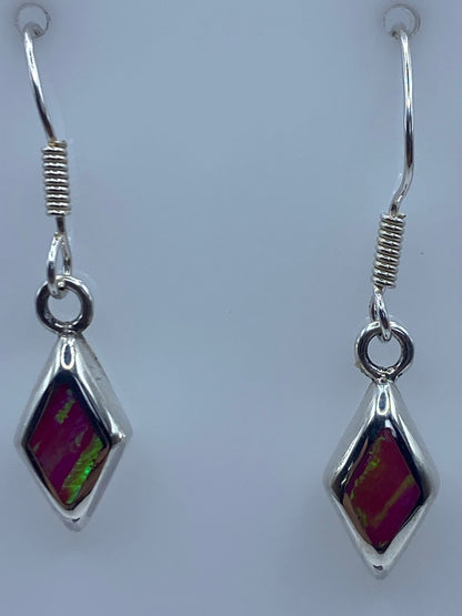 Aretes sobre escala de milimetros mostrando largo de 3 cm