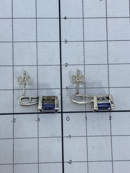 Aretes sobre escala con el Quinto 925 visible en la plata