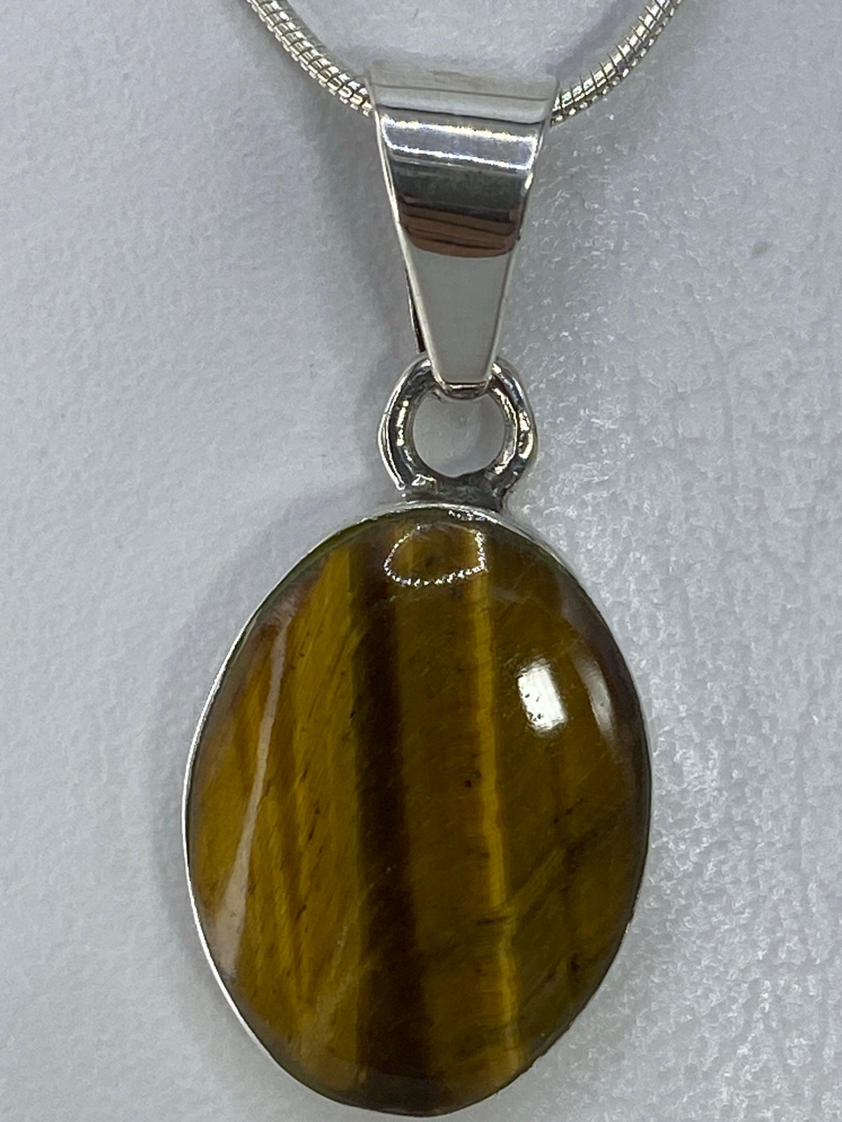 Dije de plata 950 con piedra multicolor incrustada, 3.2 cm de largo
