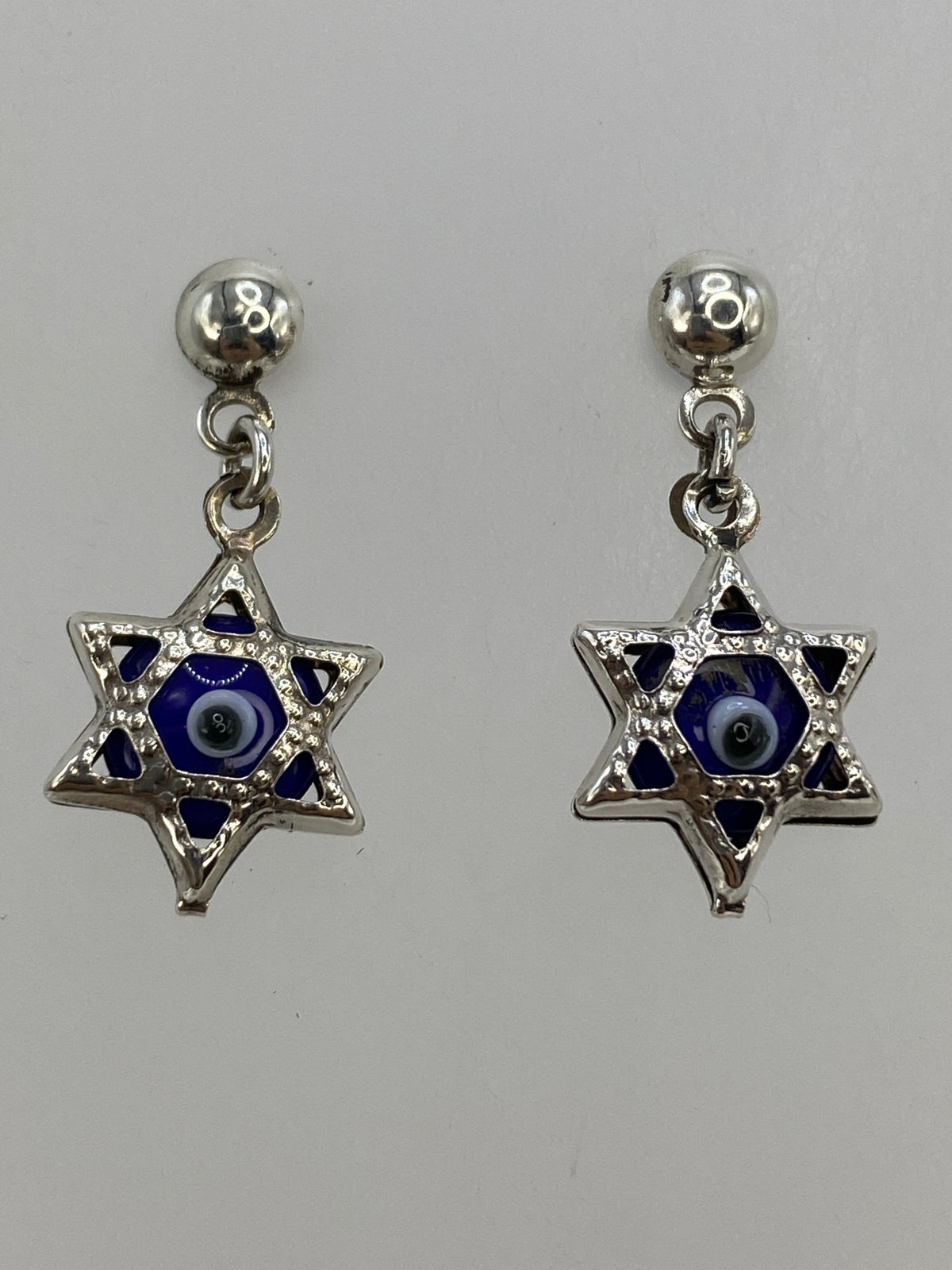 Detalle del calado de Taxco en la Estrella de David con ojo protector