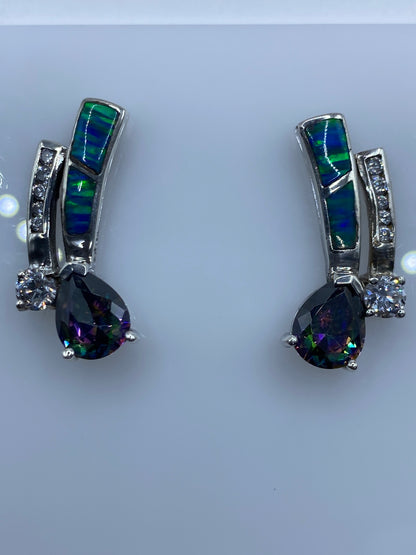 Aretes sobre regla métrica mostrando el largo de 2.3 cm