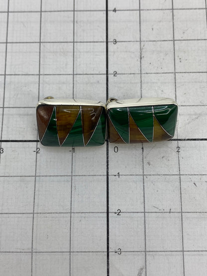 Aretes sobre bascula mostrando peso total de 11.05 gramos con Quinto 925 grabado