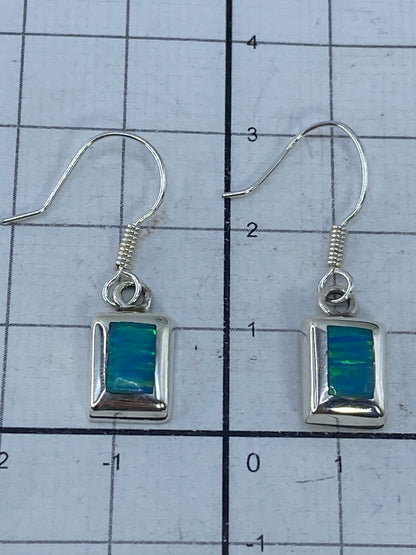 Aretes con marca de Quinto 925 visible en la plata