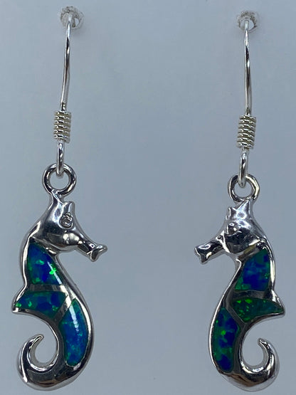 Aretes junto a regla mostrando largo de 3.7 cm